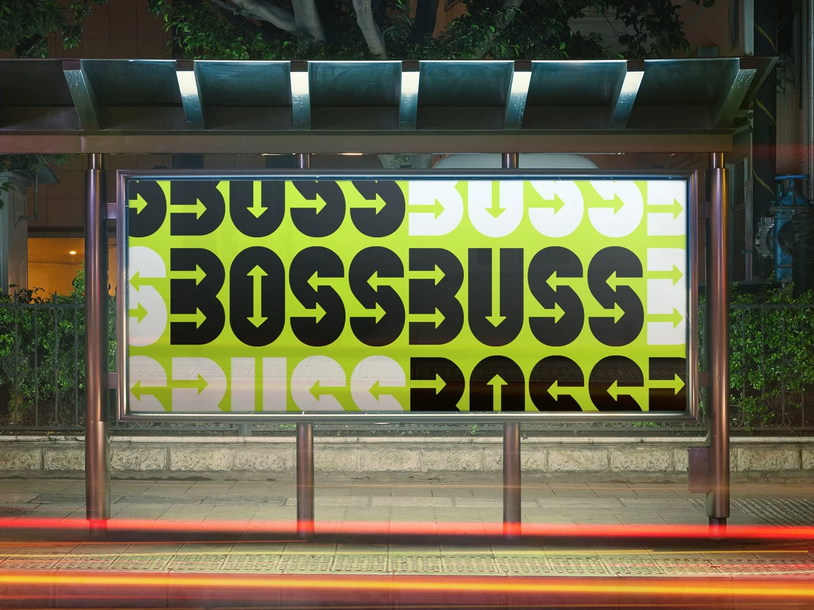 Bossbuss grafiska profil i limegrönt och svart på en upplyst reklamskylt vid en busshållplats.